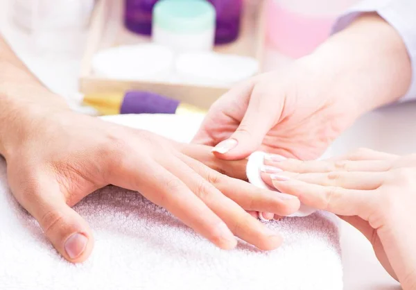 Hands during manicure care session — Stock Photo, Image