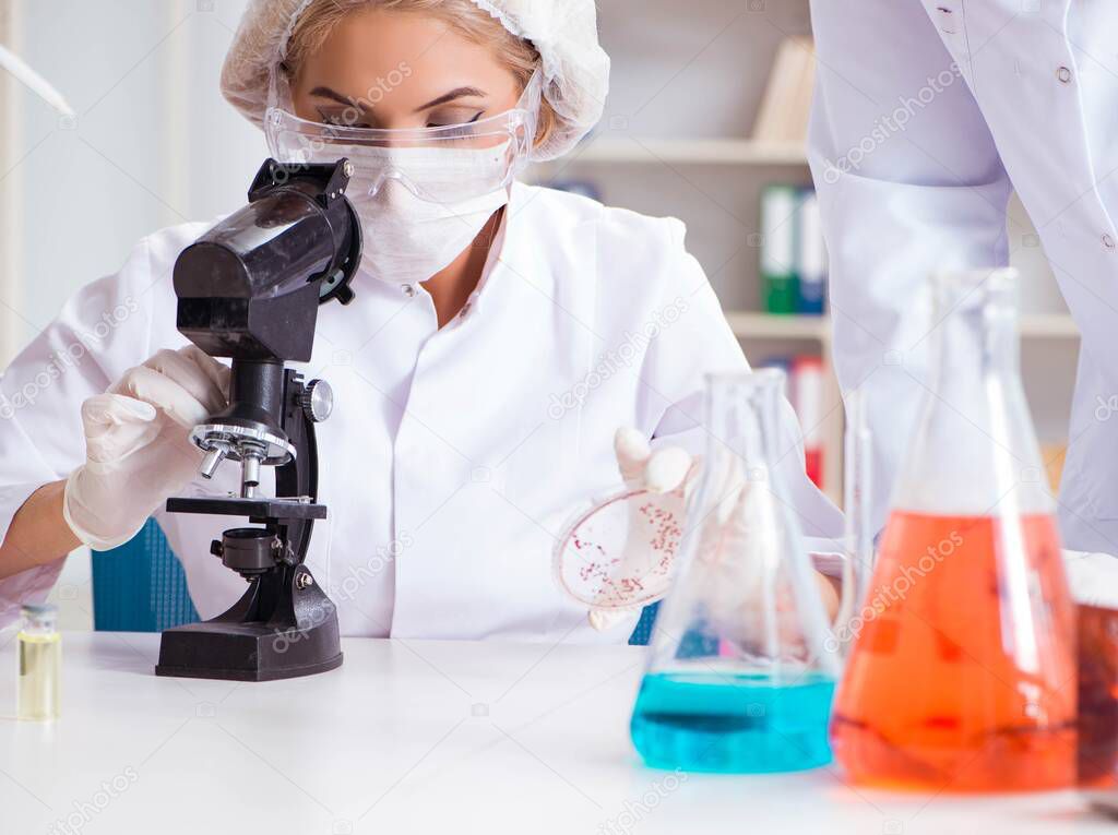 Young female woman doctor in hospital clinic lab