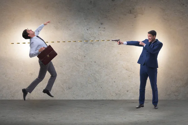 Businessman with gun threatening his competitor