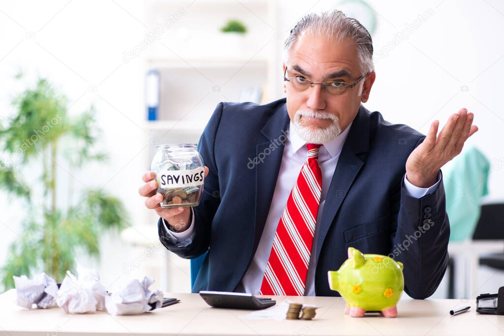 Old male accountant in budget planning concept