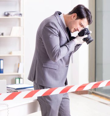 Forensics investigator at the scene of office crime clipart