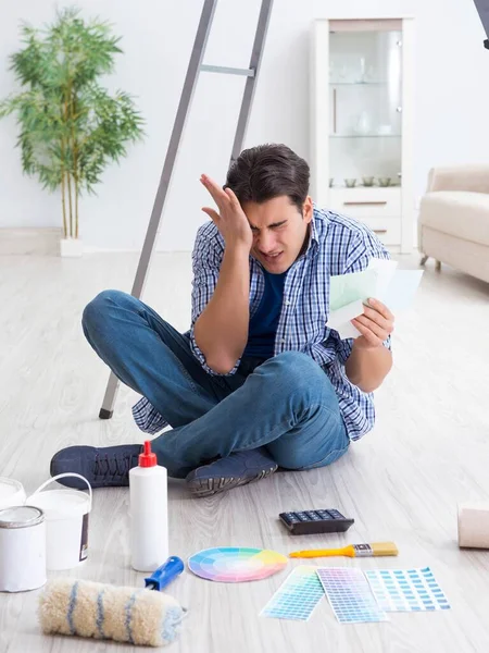 Young man overspending his budget in refurbishment project — Stock Photo, Image