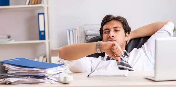 Young handsome businessman working in office — Stock Photo, Image