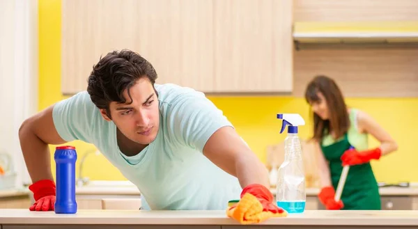 Young couple working at kitchen — Stock Photo, Image