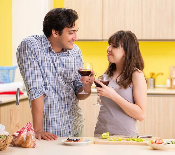 Young couple celebrating wedding anniversary at kitchen — Stock Photo, Image