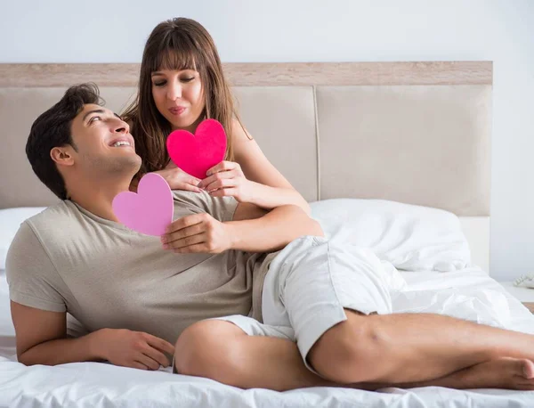 Happy couple in the bed — Stock Photo, Image