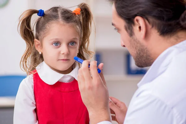 Small girl visiting young male doctor oculist — Stock Photo, Image