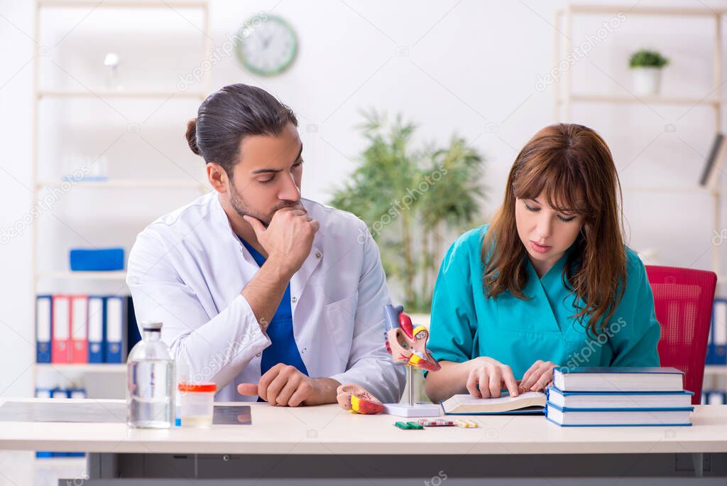 Two doctors colleagues working in the hospital