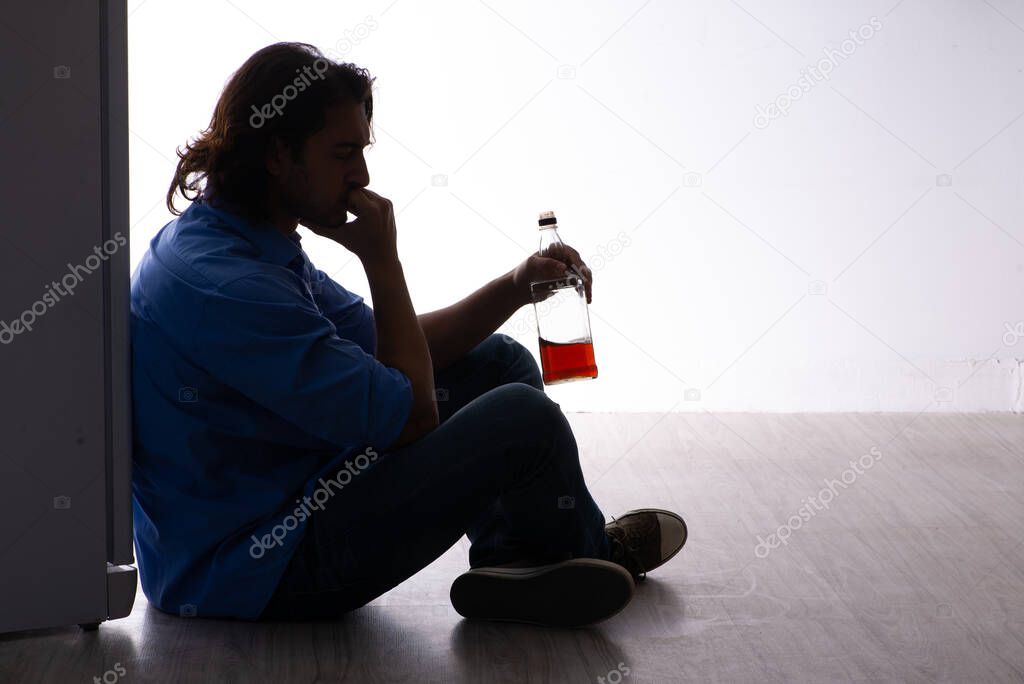 Young man suffering from alcoholism