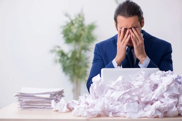 Businessman rejecting new ideas with lots of papers — Stock Photo, Image