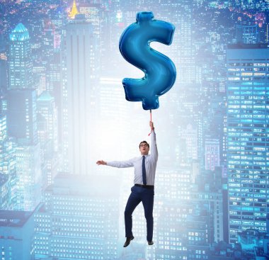 Dolar işareti üzerinde uçan iş adamı şişme balon