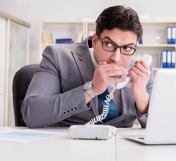 Businessman leaking confidential information over phone