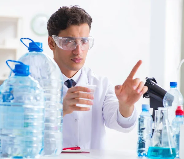 Lab assistant testing water quality