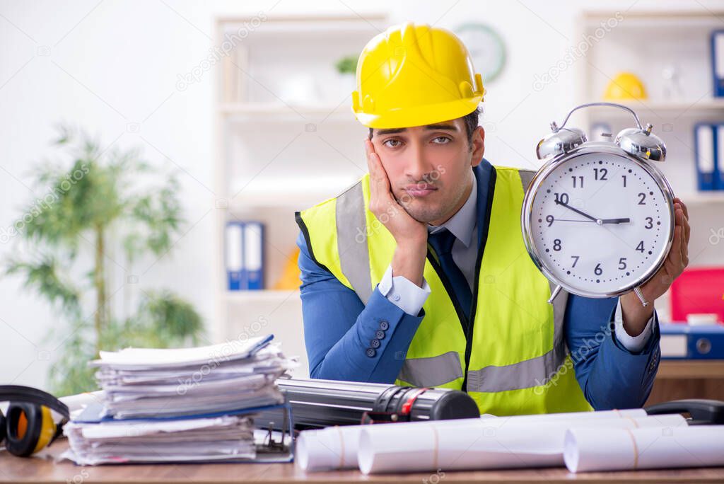 Young male architect working in the office