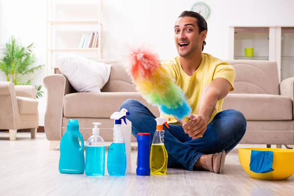 Young male contractor doing housework at home — Stock Photo, Image