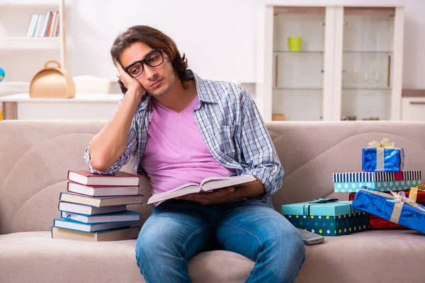 Young male student preparing for exams during Christmas — Stock Photo, Image
