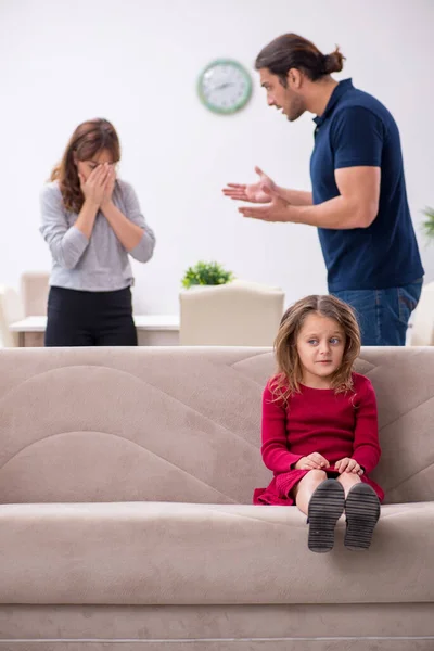 Young couple and their daughter in family conflict concept — Stock Photo, Image