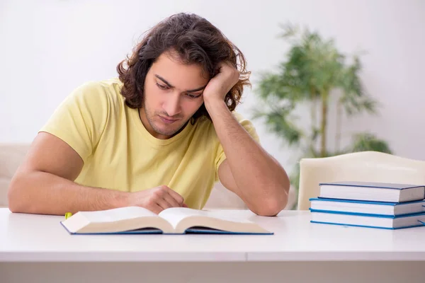 Young male student preparing for exams at home — Stock Photo, Image