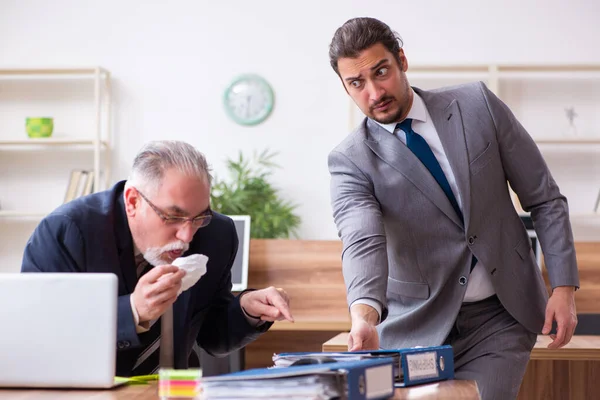 Two employees in pandemic concept at workplace — Stock Photo, Image