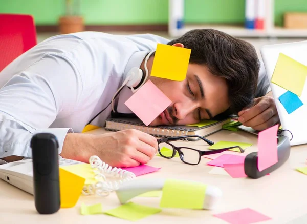 Young help desk operator working in office with many conflicting — Stock Photo, Image