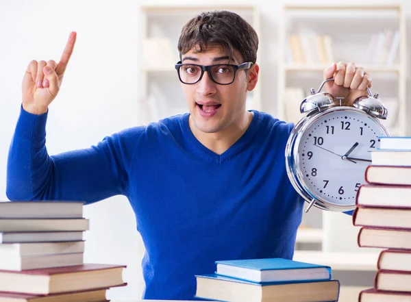 Male student preparing for exams in college library — Stock Photo, Image