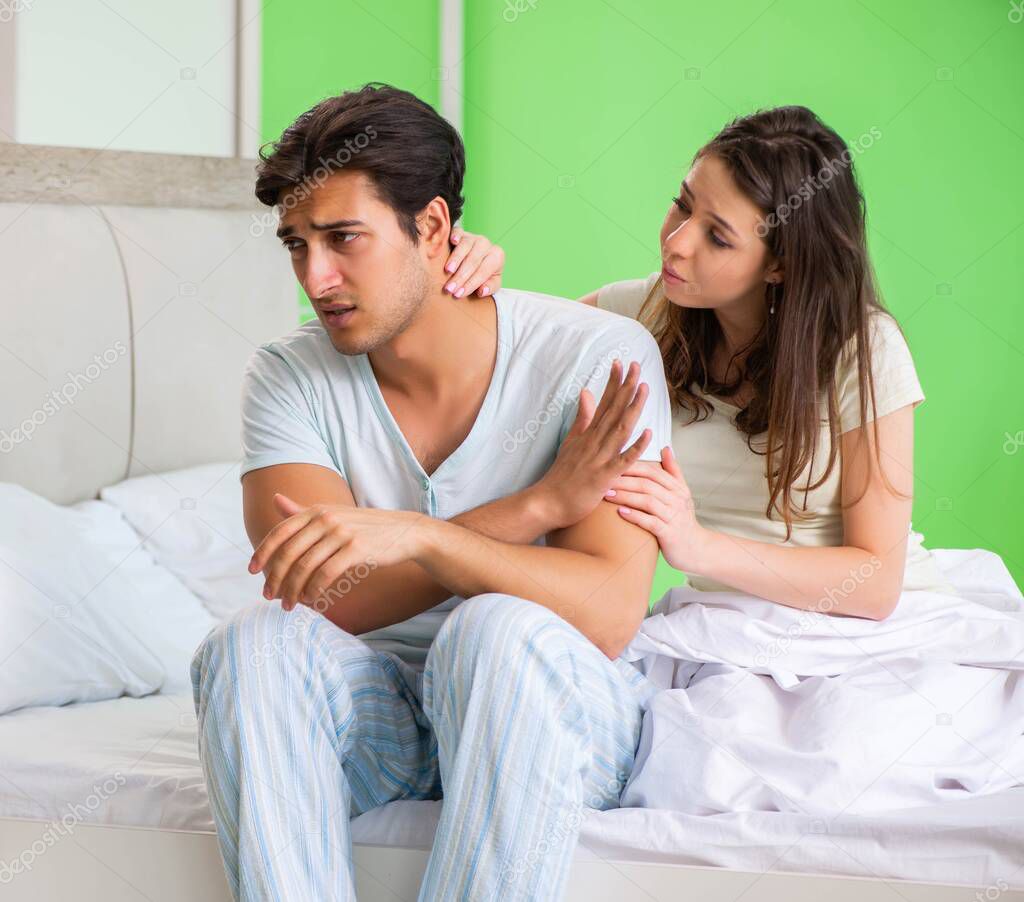 Young woman consoling disappointed impotent husband