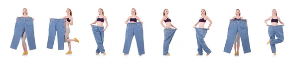 Woman with large jeans in dieting concept — Stock Photo, Image