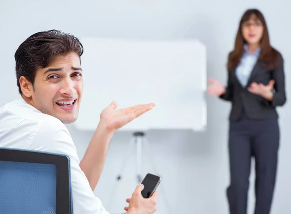 Business presentation in the office with man and woman — Stock Photo, Image