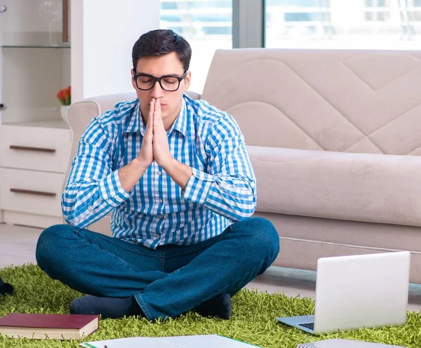 Student meditating and preparing for university exams — Stock Photo, Image