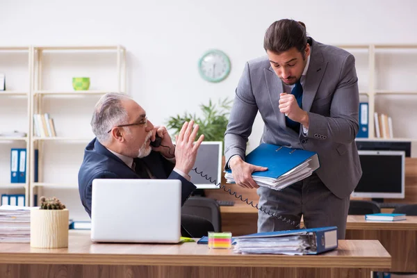 Two employees in pandemic concept at workplace — Stock Photo, Image