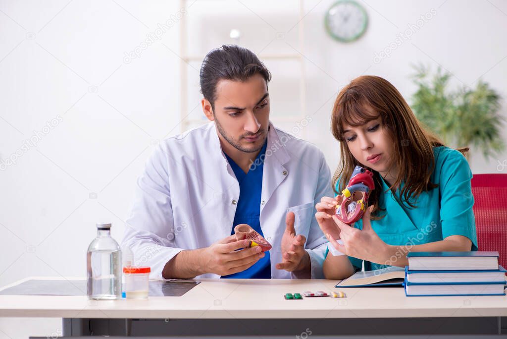 Two doctors colleagues working in the hospital