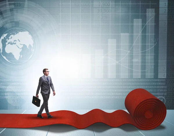 Businessman walking on red carpet — Stock Photo, Image