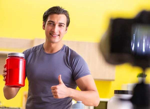 Young man blogging about food supplements — Stock Photo, Image