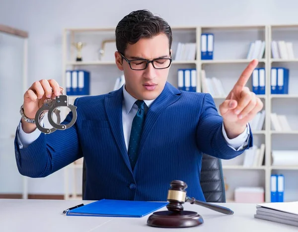 Young lawyer judge sitting in the office