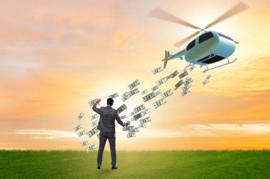 İş adamıyla helikopter para konsepti