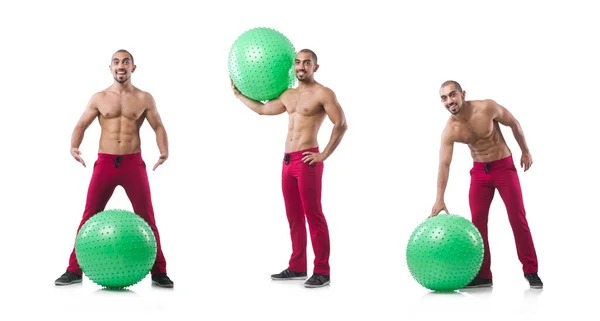 Homem com bola suíça fazendo exercícios em branco — Fotografia de Stock