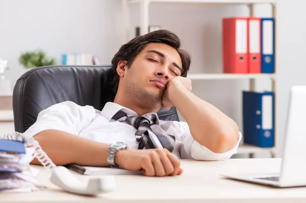 Young handsome businessman working in office — Stock Photo, Image