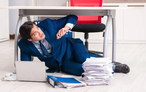 Tired exhausted businessman working overtime in office — Stock Photo, Image