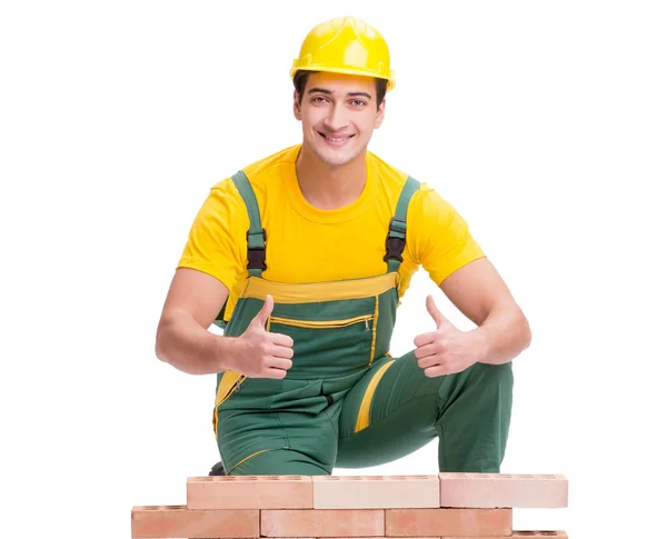 The handsome construction worker building brick wall — Stock Photo, Image