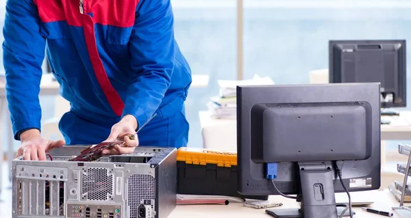 Computer repairman specialist repairing computer desktop