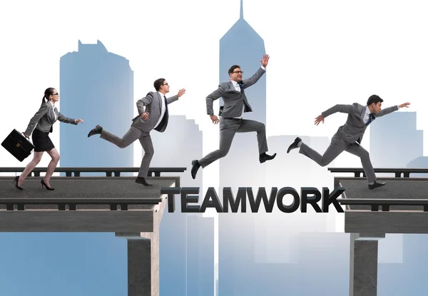 Teamwork concept with business people crossing bridge — Stock Photo, Image