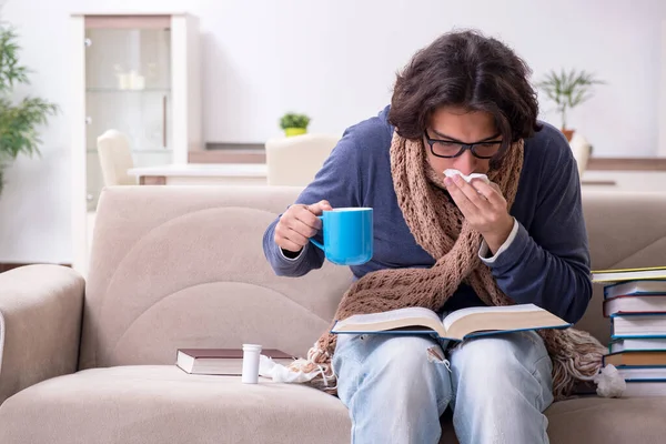 Sick male student suffering at home — Stock Photo, Image