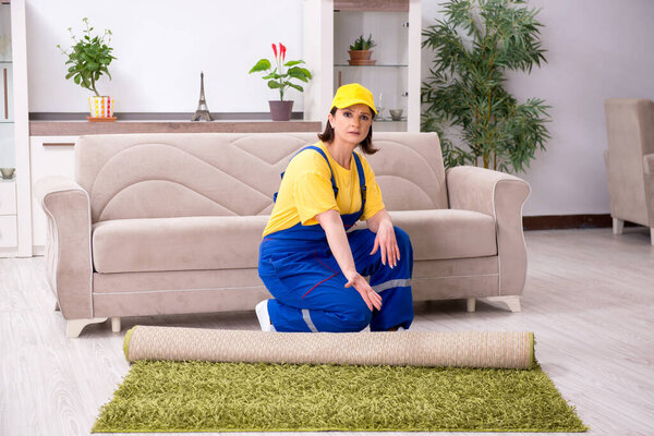 Old female contractor doing housework