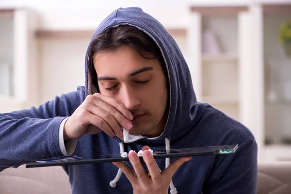 Young man having problems with narcotics at home — Stock Photo, Image