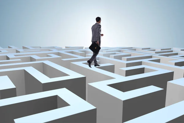 Businessman trying to escape from maze — Stock Photo, Image