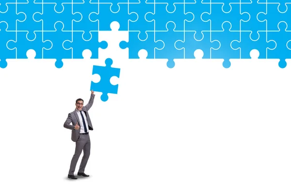 Concept of businessman with missing jigsaw puzzle piece — Stock Photo, Image