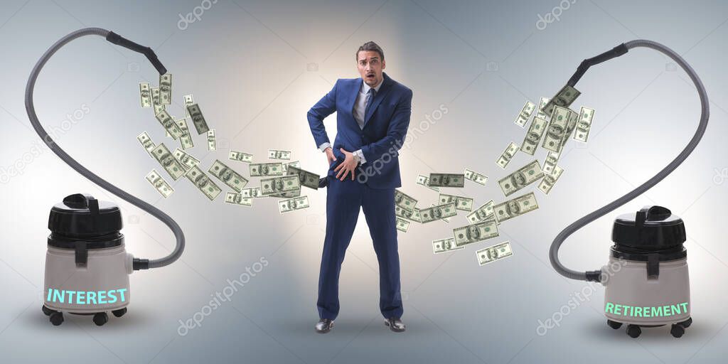 Businessman and vacuum cleaner sucking money out of him