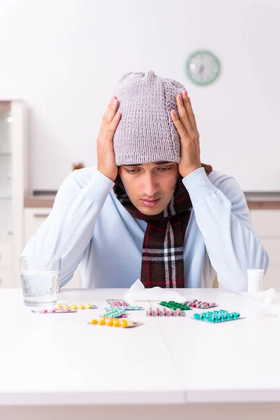 Young man suffering from flu at home — Stock Photo, Image