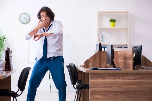 Young male employee unhappy with excessive work — Stock Photo, Image