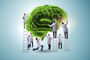 Bir grup doktor insan beynini inceliyor.